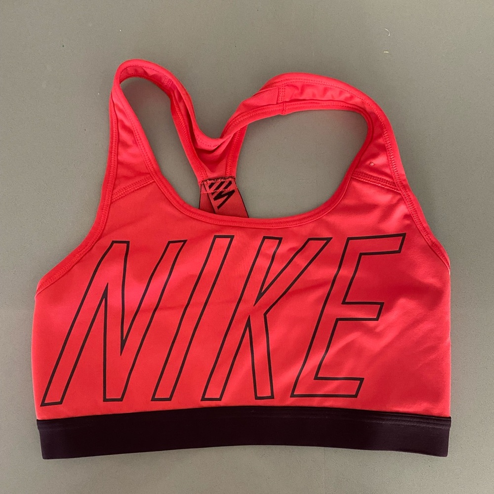 Nike Dry fit sports bra in S. Pockets to add inserts if desired.